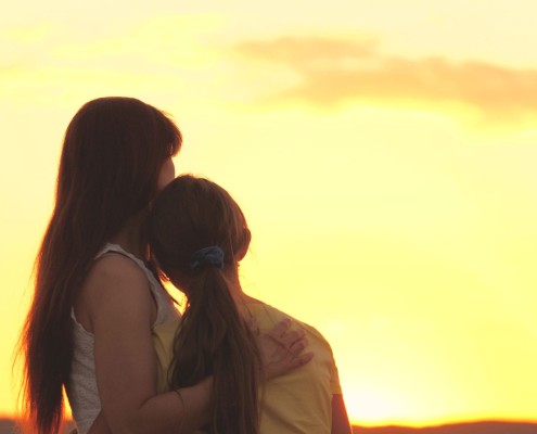 Mother,Hugs,Teenager,Girl,At,Sunset,In,Sky,,Difficult,Age,